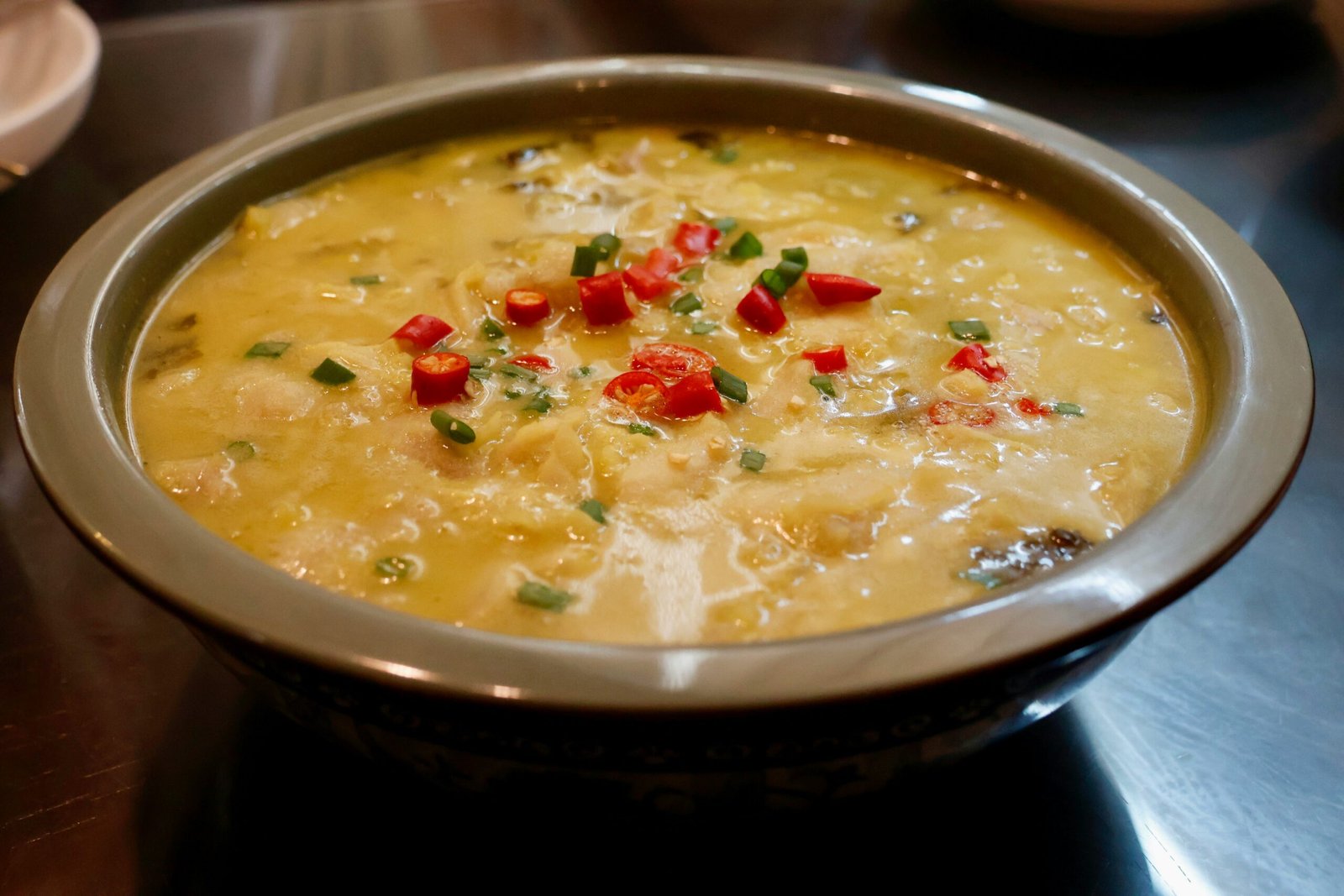 a bowl of soup is sitting on a table